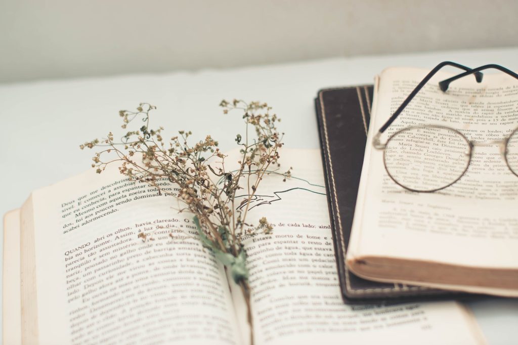 black framed eyeglasses on book page